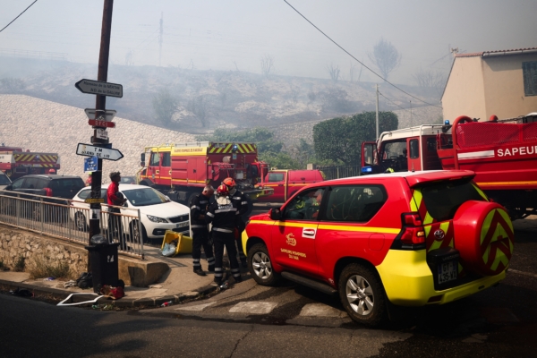 Forest wildfires break out in southern France, Marseille airport closed, trains suspended.