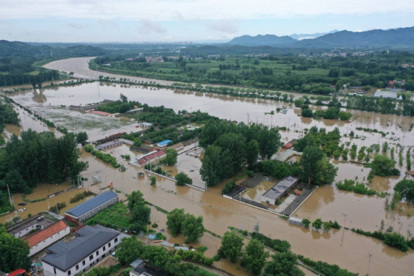 Another round of rainfall hits, Beijing issues red alert for heavy rain again.